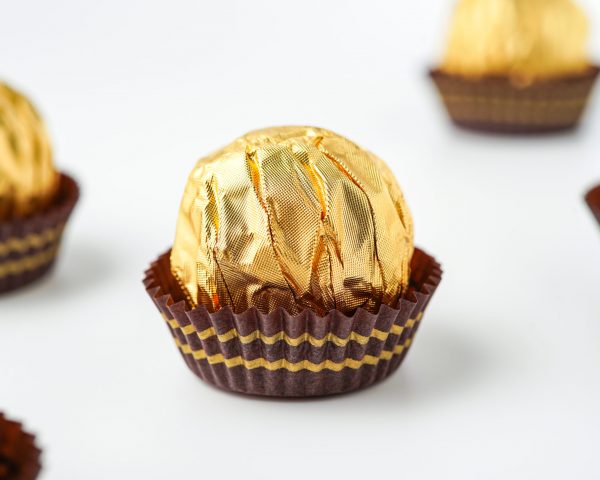 chocolate balls filled with hazelnuts, chocolate sweets in a gold wrapper